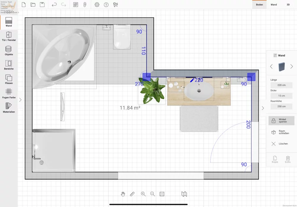 Zwei Hände halten einen Bauplan: Badewanne, Dusche, Waschbecken und Maße sind klar zu erkennen. In der Mitte steht eine Pflanze.